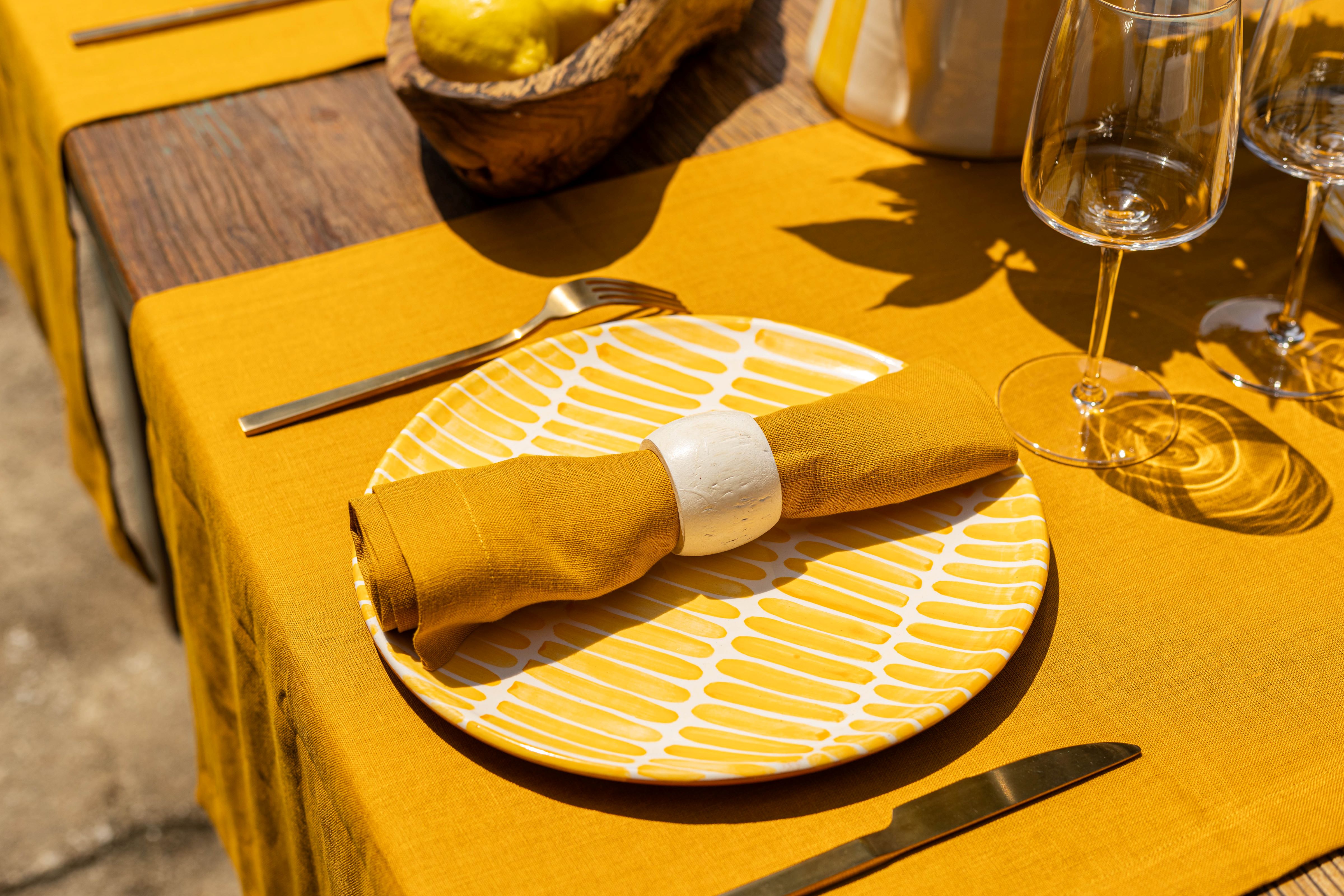 Yellow table runner linen with yellow mustard napkins summer table with table runners.