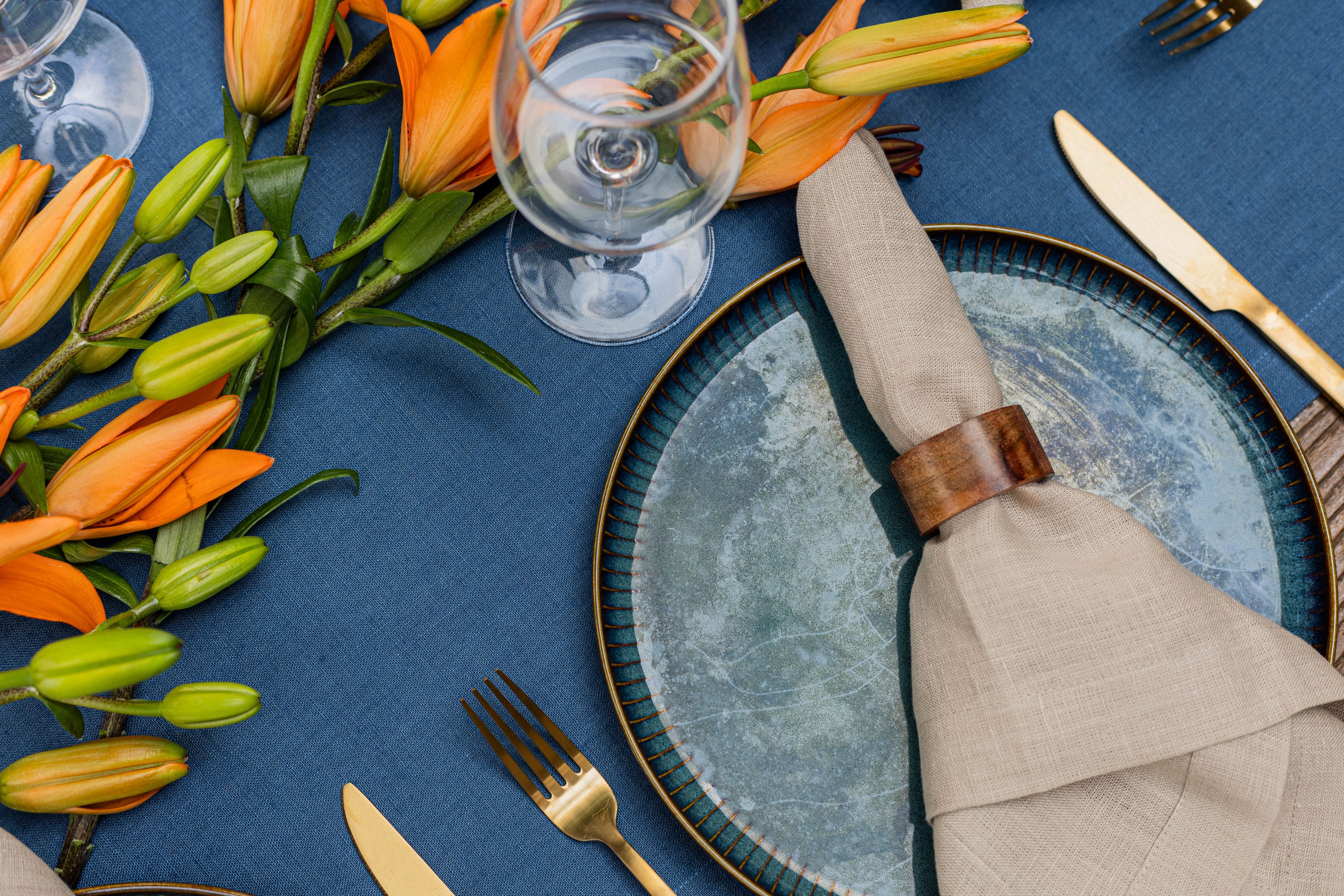 Blue linen tablecloth with beige sand napkins