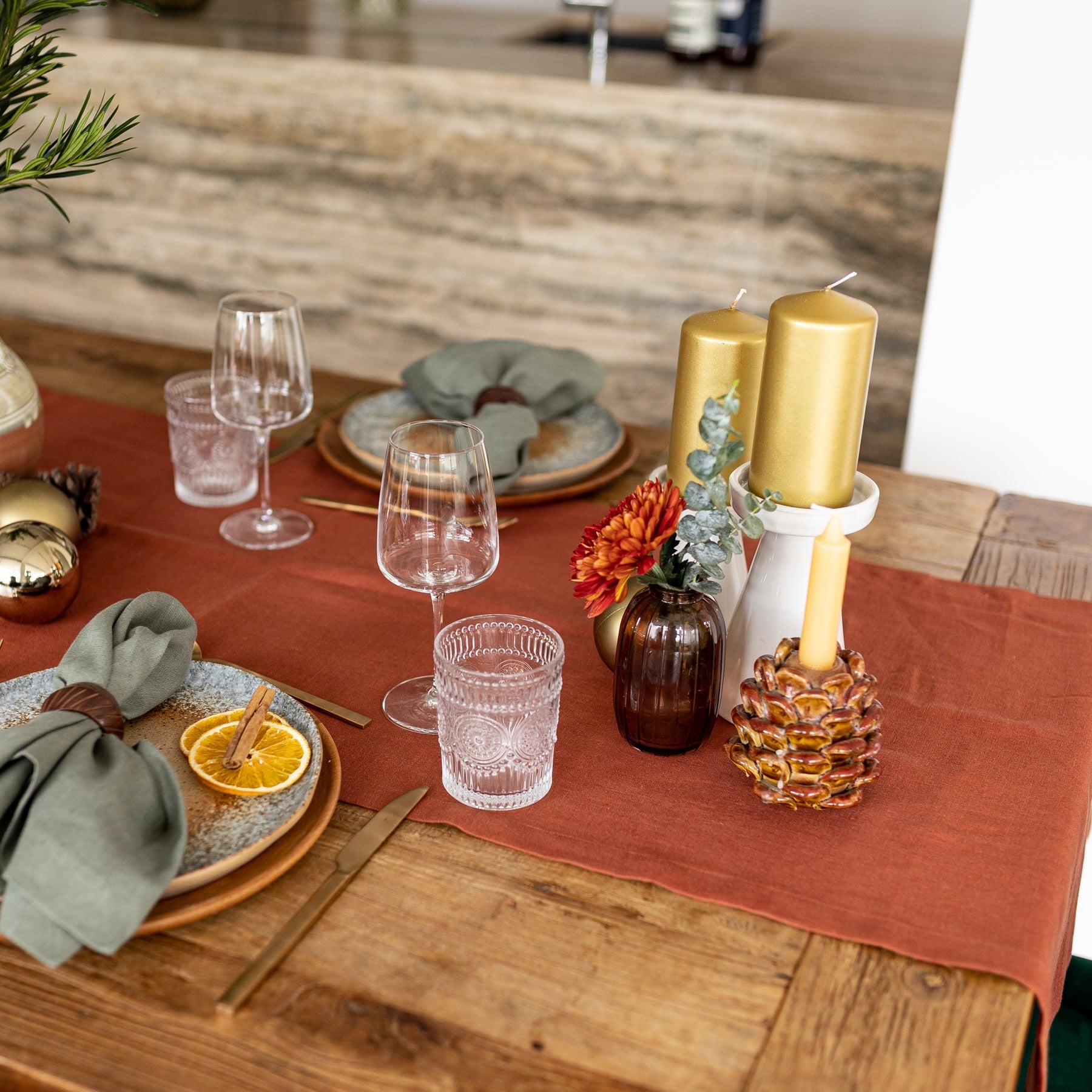 Terracotta linen table runner with green olive napkins 
