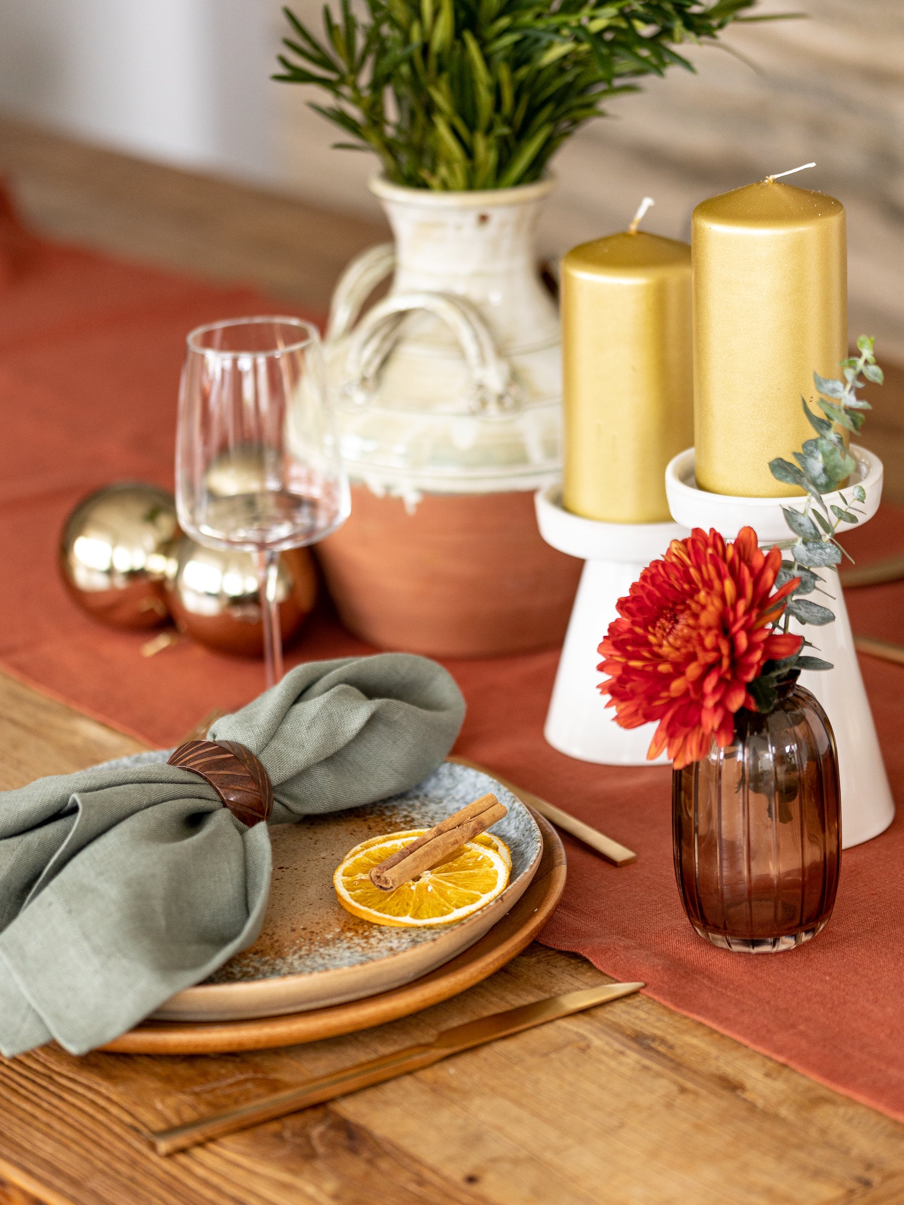 Terracotta linen table runner with green olive napkins 